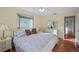 King-size bed, dresser and large windows in a sunny bedroom at 7030 Lafayette N, Pinellas Park, FL 33781