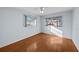 Bright bedroom featuring wood-look flooring and ample natural light at 7030 Lafayette N, Pinellas Park, FL 33781