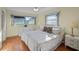 Spacious bedroom with wood floors, large windows, and ample closet space at 7030 Lafayette N, Pinellas Park, FL 33781