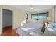 Bedroom with king bed, wood floors, and walk-in closet at 7030 Lafayette N, Pinellas Park, FL 33781
