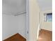 Large walk-in closet with wood flooring and shelving at 7030 Lafayette N, Pinellas Park, FL 33781