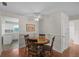 Cozy dining area with a round table, four chairs, and kitchen access at 7030 Lafayette N, Pinellas Park, FL 33781