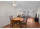 Small dining area with a round table and four chairs near the living room at 7030 Lafayette N, Pinellas Park, FL 33781