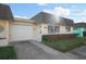 Attractive exterior with a carport and well-manicured lawn at 7030 Lafayette N, Pinellas Park, FL 33781
