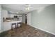 Bright kitchen features white cabinetry, tile backsplash and breakfast bar at 7030 Lafayette N, Pinellas Park, FL 33781