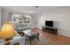 Living room features hardwood floors, neutral walls, and ample natural light at 7030 Lafayette N, Pinellas Park, FL 33781