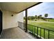 Spacious balcony overlooking a lush green golf course at 3021 Countryside Blvd # 28A, Clearwater, FL 33761