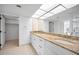 Double vanity bathroom with granite countertops at 3021 Countryside Blvd # 28A, Clearwater, FL 33761