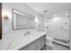 Modern bathroom with a large walk-in shower and quartz countertop at 3021 Countryside Blvd # 28A, Clearwater, FL 33761