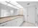 Modern bathroom with granite countertops, white cabinets, and walk-in shower at 3021 Countryside Blvd # 28A, Clearwater, FL 33761