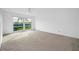 Bright bedroom with neutral carpeting and large windows at 3021 Countryside Blvd # 28A, Clearwater, FL 33761