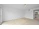 Spacious bedroom with neutral walls and carpeting, plus a ceiling fan at 3021 Countryside Blvd # 28A, Clearwater, FL 33761