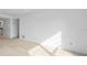 Well-lit bedroom featuring neutral walls and carpet at 3021 Countryside Blvd # 28A, Clearwater, FL 33761