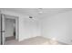 Bright bedroom with double doors leading to closet and access to bathroom at 3021 Countryside Blvd # 28A, Clearwater, FL 33761