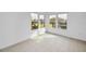 Sunlit dining area with tile floors and large windows at 3021 Countryside Blvd # 28A, Clearwater, FL 33761