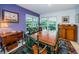 Charming dining room with a wooden table and green chairs at 3021 Countryside Blvd # 28A, Clearwater, FL 33761
