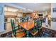 Open dining room with view into kitchen and living room at 3021 Countryside Blvd # 28A, Clearwater, FL 33761