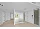 Bright entryway with tiled floors and mirrored accent wall at 3021 Countryside Blvd # 28A, Clearwater, FL 33761