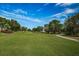 View of the golf course with lush green grass at 3021 Countryside Blvd # 28A, Clearwater, FL 33761