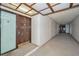 Interior hallway with access to unit and building amenities at 3021 Countryside Blvd # 28A, Clearwater, FL 33761