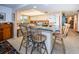 Kitchen features a breakfast bar and granite countertops at 3021 Countryside Blvd # 28A, Clearwater, FL 33761