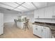 Spacious kitchen with breakfast bar and granite countertops at 3021 Countryside Blvd # 28A, Clearwater, FL 33761
