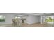 Open kitchen with granite counters, white cabinets, and breakfast bar at 3021 Countryside Blvd # 28A, Clearwater, FL 33761