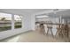 Kitchen features granite counters, white cabinets and breakfast bar at 3021 Countryside Blvd # 28A, Clearwater, FL 33761