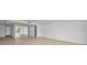 Bright and airy living room with tile floors and large mirror at 3021 Countryside Blvd # 28A, Clearwater, FL 33761