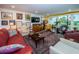 Living room with a view of the golf course and plenty of natural light at 3021 Countryside Blvd # 28A, Clearwater, FL 33761