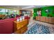 Bright living room with colorful furniture and view of golf course at 3021 Countryside Blvd # 28A, Clearwater, FL 33761