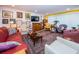 Bright living room featuring hardwood floors and a wall of artwork at 3021 Countryside Blvd # 28A, Clearwater, FL 33761