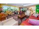 Spacious living room with colorful decor and open floor plan at 3021 Countryside Blvd # 28A, Clearwater, FL 33761