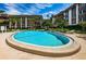 Clean and refreshing community pool with lounge chairs at 3021 Countryside Blvd # 28A, Clearwater, FL 33761