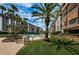 Relaxing pool area with lush landscaping and patio furniture at 3021 Countryside Blvd # 28A, Clearwater, FL 33761