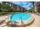 Sparkling community pool with surrounding lounge chairs at 3021 Countryside Blvd # 28A, Clearwater, FL 33761