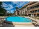 Refreshing swimming pool surrounded by a sun deck at 3021 Countryside Blvd # 28A, Clearwater, FL 33761
