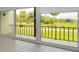 Sliding glass doors reveal a scenic golf course view at 3021 Countryside Blvd # 28A, Clearwater, FL 33761