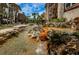 Relaxing water feature with cascading waterfall and lush landscaping at 3021 Countryside Blvd # 28A, Clearwater, FL 33761