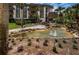 Landscaped pond and walkway in front of a condo building at 3021 Countryside Blvd # 28A, Clearwater, FL 33761
