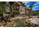Dual water features with palm trees and condo building in the background at 3021 Countryside Blvd # 28A, Clearwater, FL 33761