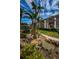Tranquil pond with palm trees and condo buildings in the background at 3021 Countryside Blvd # 28A, Clearwater, FL 33761