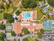Aerial shot of the community amenities including a pool, tennis courts, golf course, and clubhouse at 3332 Mcmath Dr, Palm Harbor, FL 34684