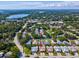 Charming neighborhood with lush green trees near the beautiful lake and various community amenities at 3332 Mcmath Dr, Palm Harbor, FL 34684