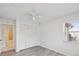 Bedroom with closet, neutral paint, and wood-look floors at 3332 Mcmath Dr, Palm Harbor, FL 34684