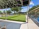 Relax at the bocce ball court with shaded seating and scenic views for a delightful outdoor experience at 3332 Mcmath Dr, Palm Harbor, FL 34684