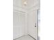 Entryway with a closet and a glass inset front door that welcomes natural light at 3332 Mcmath Dr, Palm Harbor, FL 34684