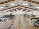 Spacious meeting room with ample seating, ceiling fans, and tile flooring, suitable for gatherings at 3332 Mcmath Dr, Palm Harbor, FL 34684