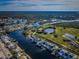 Wide aerial showcasing waterfront homes and canals at 5305 Boardwalk St, Holiday, FL 34690