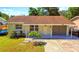 House with driveway, yard, and small boat at 6220 5Th S Ave, St Petersburg, FL 33707